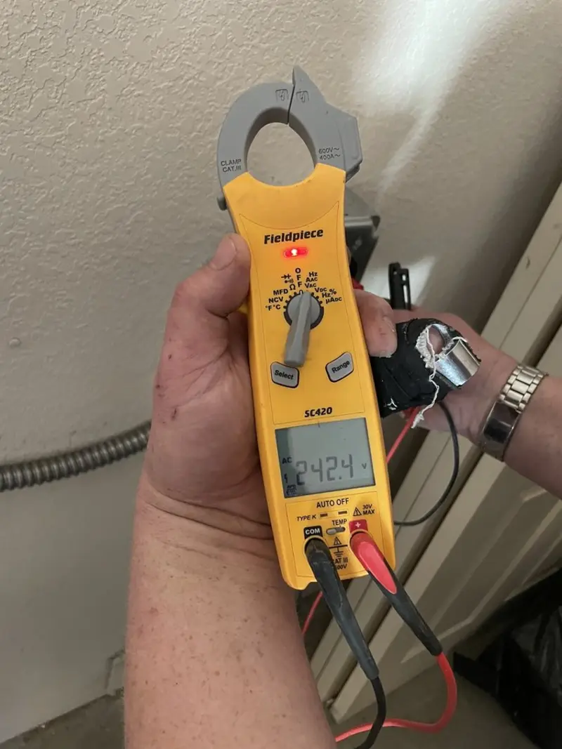 Voltage testing with clamp meter during Ceiling Fan Installation in Patterson